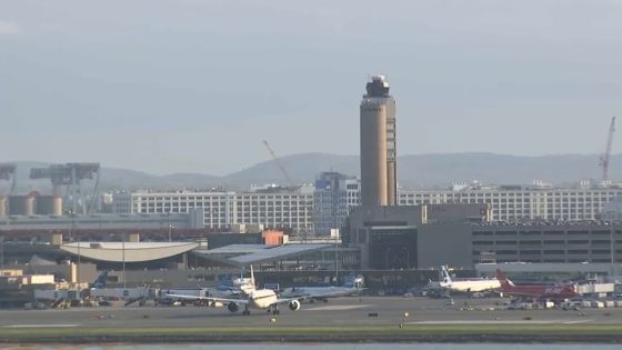 Flight crew member at Boston Logan Airport before international flight – NBC Boston