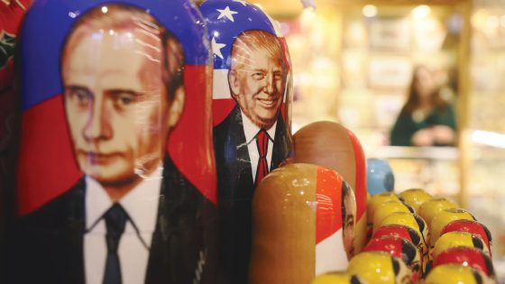 Traditional Russian Matryoshka dolls decorated with portraits of the Russian President Vladimir Putin (L) and the US President Donald Trump