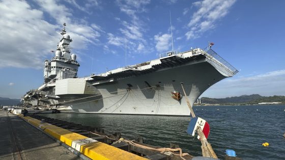 French aircraft carrier stages combat drills with Filipinos in disputed sea and visits Philippines