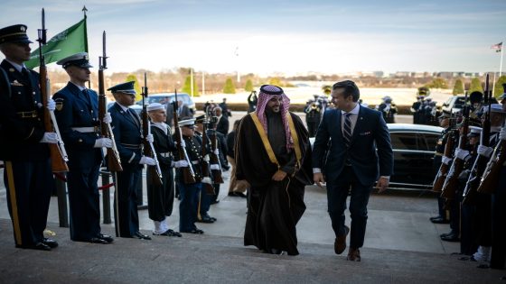 The U.S. defense secretary and Saudi Arabia's defense minister walk up the Pentagon steps.