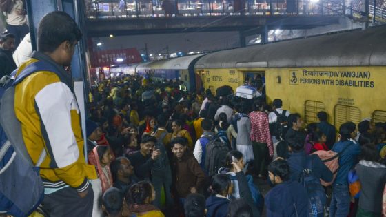 At least 18 people killed in stampede at station as thousands push to board train on way to Indian religious festival