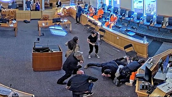 Chaos erupts in courtroom brawl as defendant is brutally attacked in homicide trial.