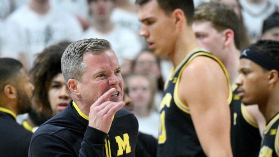 Michigan, Michigan State players shove each other, causing scrum