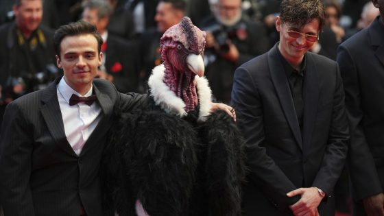 Bird man on red carpet leaves Cannes squawking