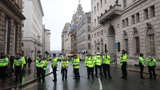 Police detain man after car collides with Liverpool parade crowd
