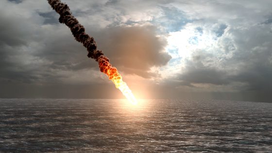 An illustration of a satellite crashing into the ocean after an uncontrolled reentry through Earth's atmosphere