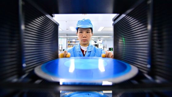 An employee packages semiconductor power devices for export at a semiconductor manufacturing enterprise. 