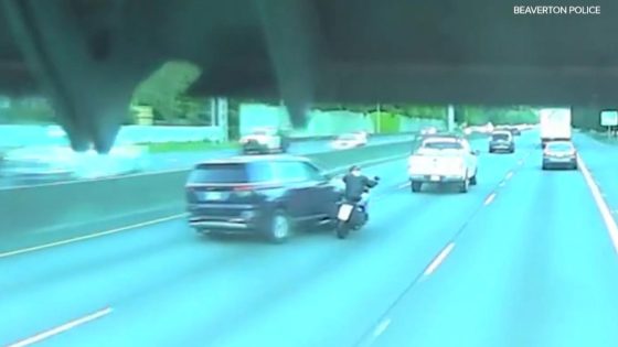 Police arrest driver suspected of pushing motorcyclist off Highway 26