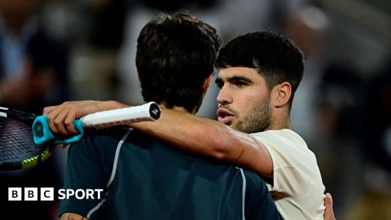 Carlos Alcaraz hugs Lorenzo Musetti