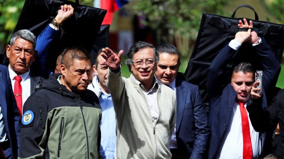 Colombia's President Gustavo Petro waves as he arrives to the signing of the labor reform