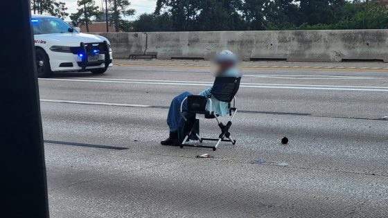 Woman sitting in chair with gun in standoff on North Freeway | Houston news