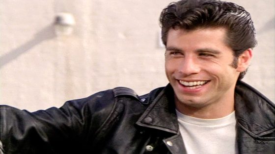 John Travolta Makes Appearance In Blond Wig As Danny Zuko At Hollywood Bowl