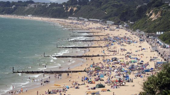 People enjoy the warm weather on Durley Chine Beach in Dorset last week. Pic: PA