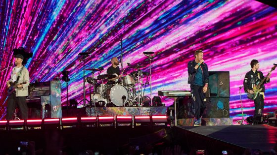 Chris Martin jokes couple is 'having an affair' at Coldplay concert after man ducks on kiss cam