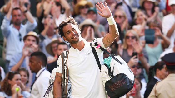 Fabio Fognini waves to the Centre Court crowd after pushing Carlos Alcaraz to five sets on Monday at Wimbledon.