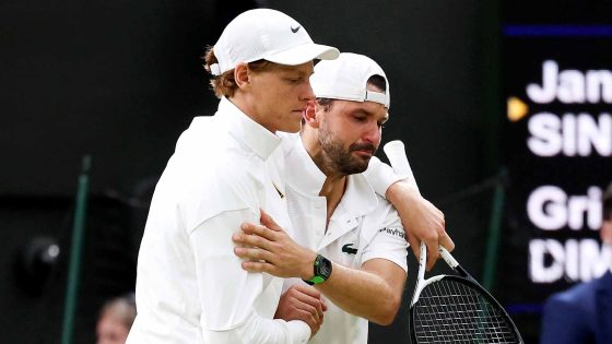 Jannik Sinner consoles Grigor Dimitrov after the Bulgarian's retirement from their match at Wimbledon on Monday.