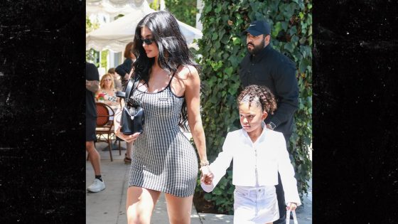 Kylie Jenner and Daughter Stormi Hold Hands on Way to Birthday Party