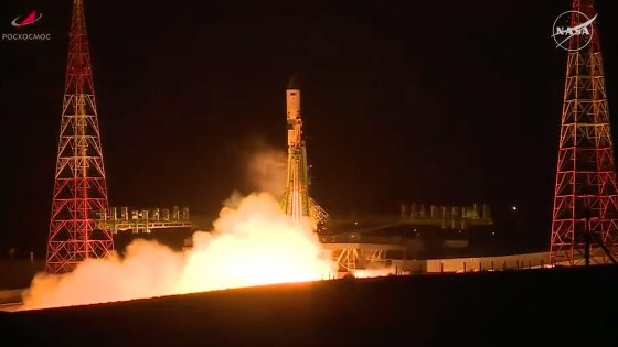 a white rocket launches into a dark night sky