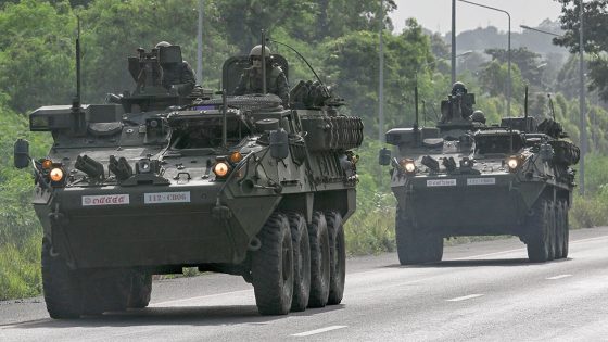 Royal Thai Army soldiers on armoured vehicles on a road in Chachoengsao province during a border row with Cambodia