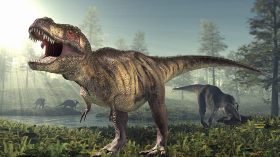 Artist's image of a swampy scene with dinosaurs roaming the background, and a large T. rex with its mouth open in the foreground.