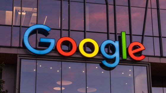 A large Google logo on the outside of a company building.