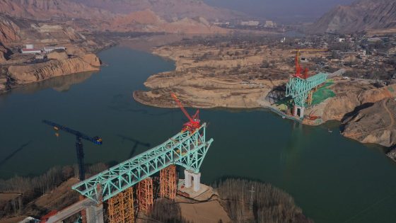 Bridge under construction in China collapses into Yellow River, killing at least 12 people, state media say