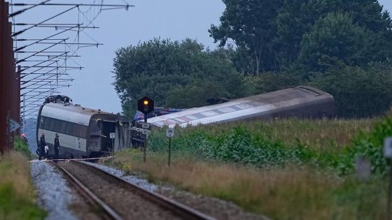 At least one person killed after train collides with tanker in Denmark, local officials say